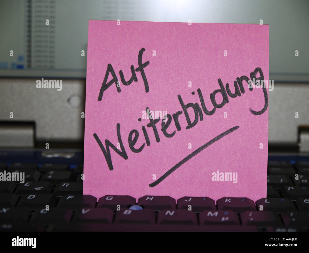 memo note on notebook on further education training Stock Photo