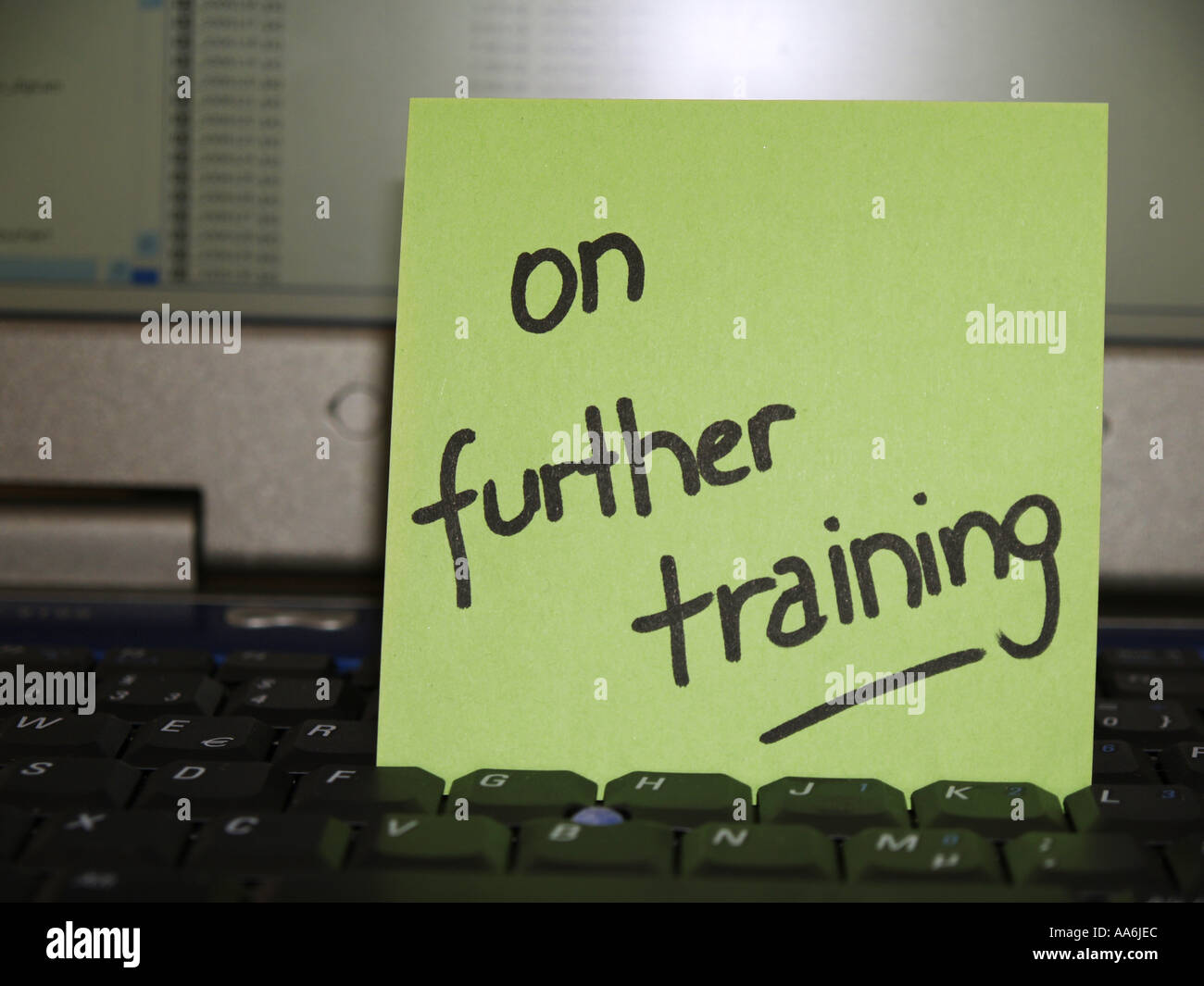 memo note on notebook on further training Stock Photo