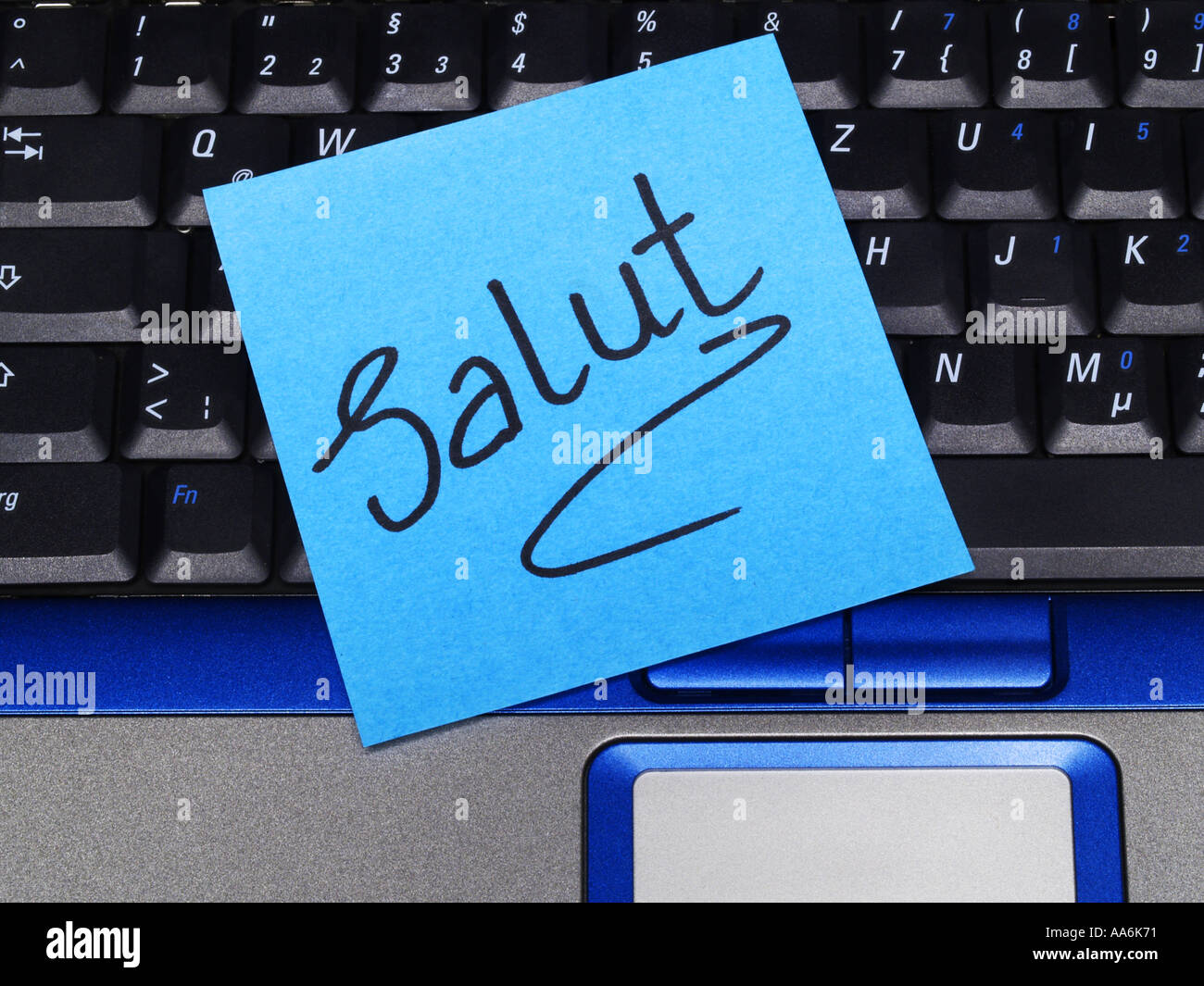 memo note on notebook, salut French hello Stock Photo