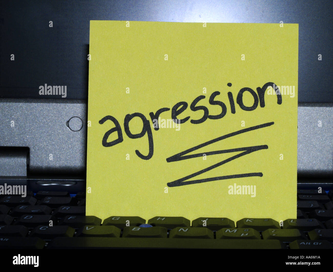 memo note on notebook, agression, aggression Stock Photo