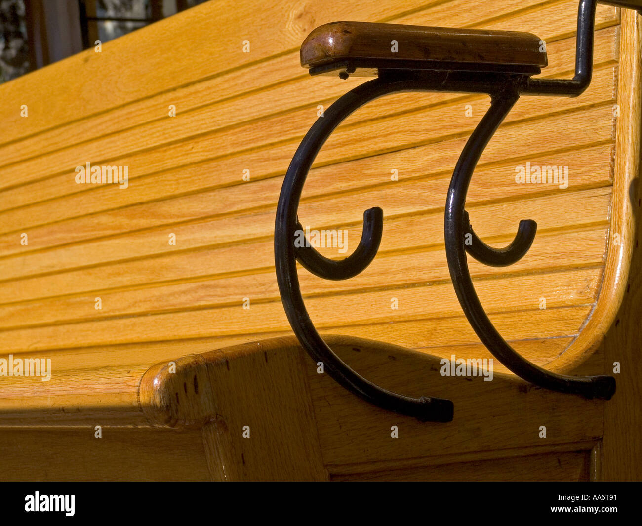 Detail on sunlit wooden bench and armrest on traditional cable cars in San Francisco City California USA Stock Photo