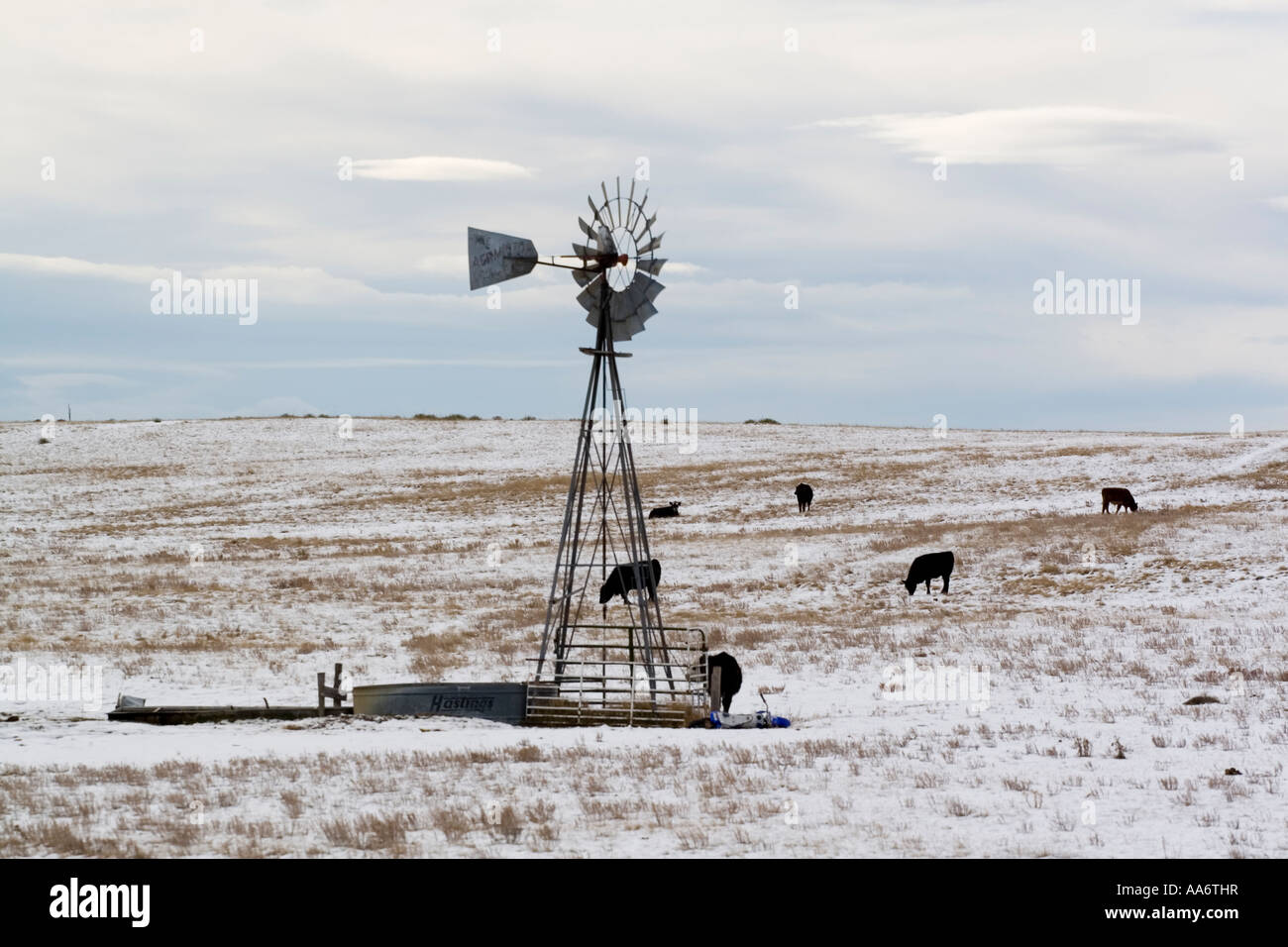 water pump in the in the snow on a cattle ranch in Wyoming WY USA Stock Photo
