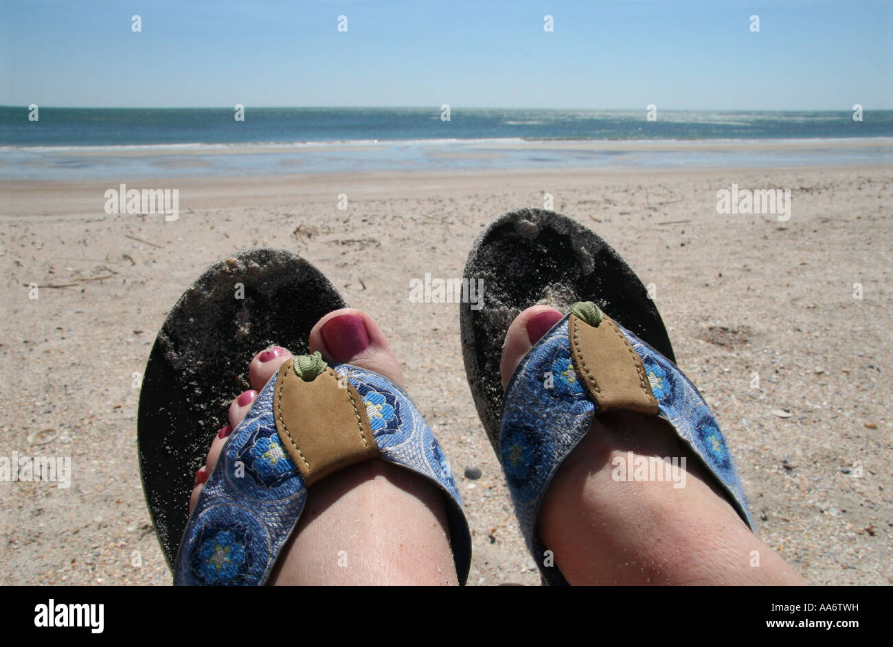 Flip flops on the beach Stock Photo - Alamy