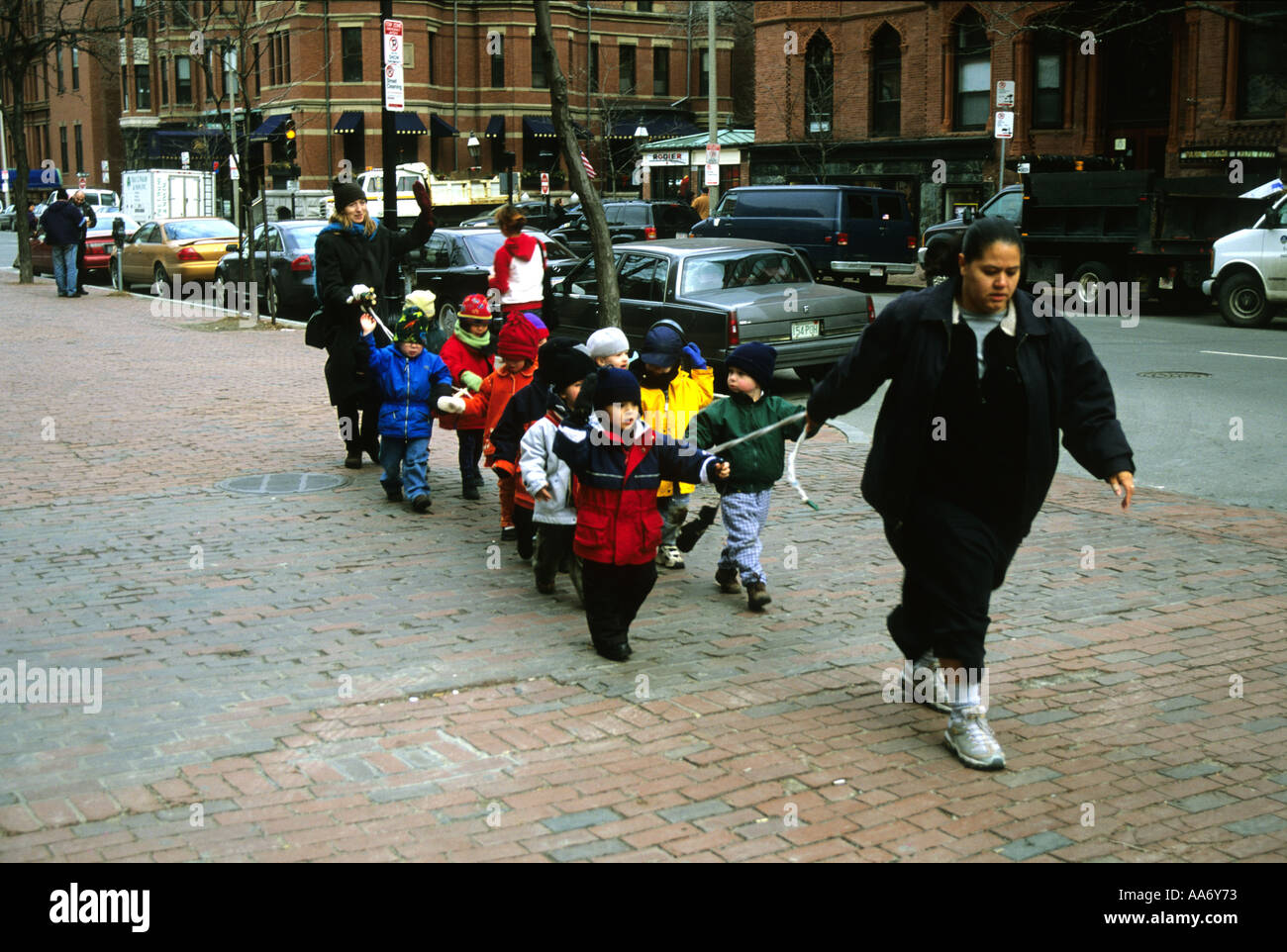 A GROUP OF CHILDREN ON A STRING IN BOSTON MASS USA Stock Photo