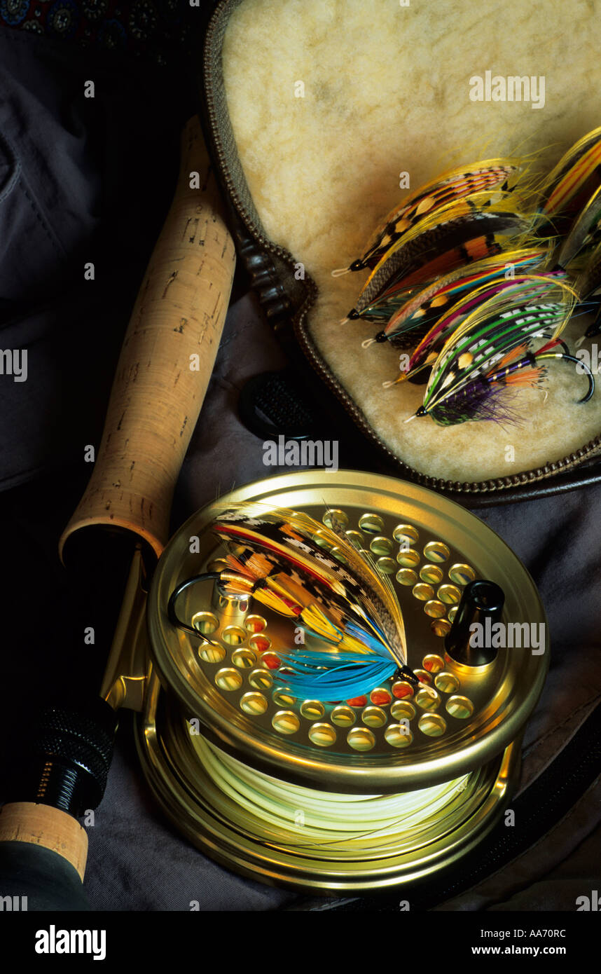 Flyfishing still life with reel and fly pouch Stock Photo - Alamy