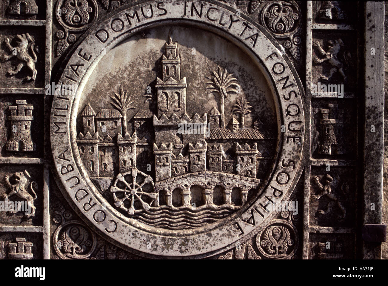 Spain Andalusia Cordoba. Shield on wall of Alcazar de los Reyes Católicos: Roman bridge, Moorish waterwheel, mosque Stock Photo