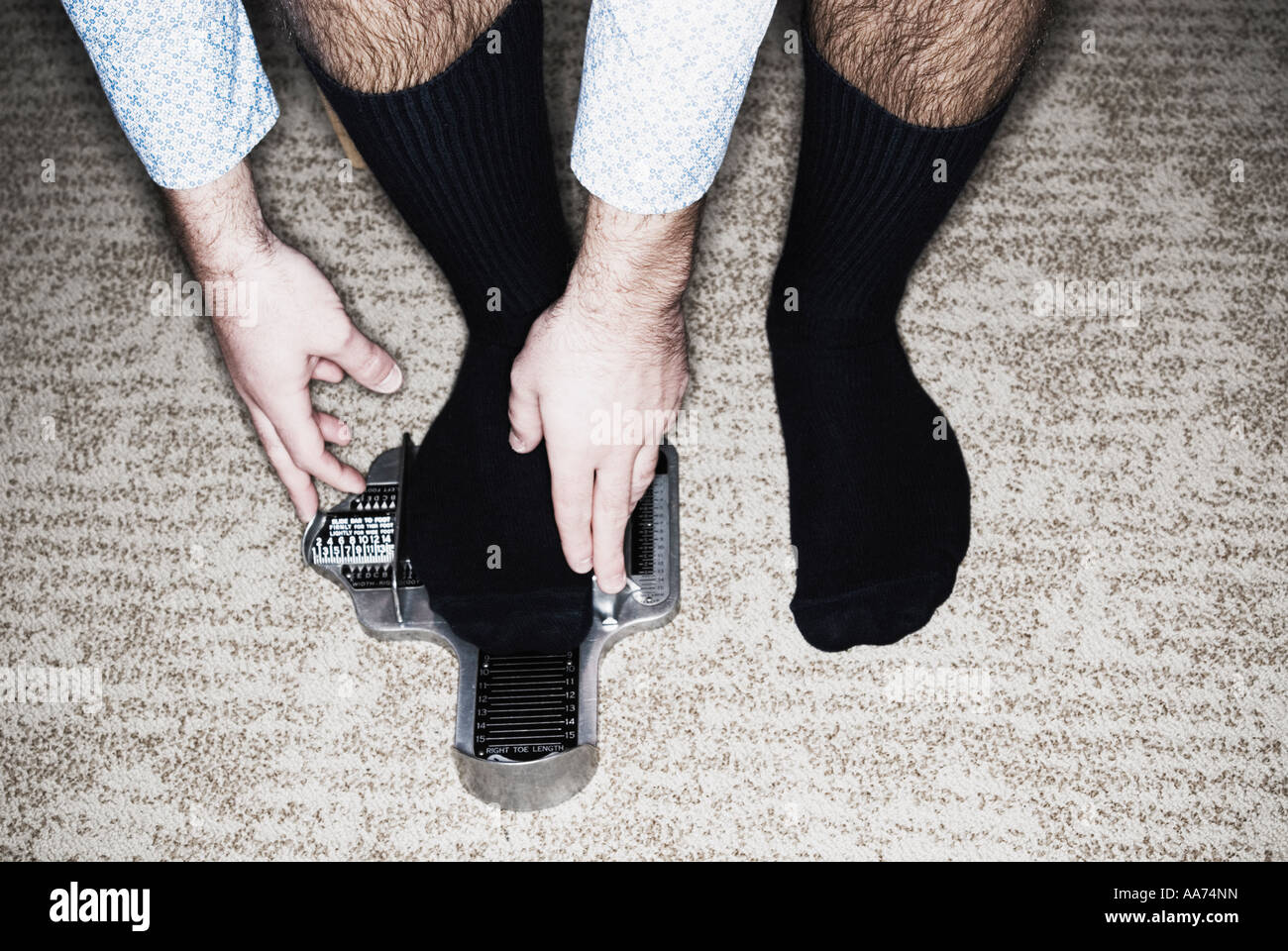 Man getting fitted for shoes Stock Photo Alamy