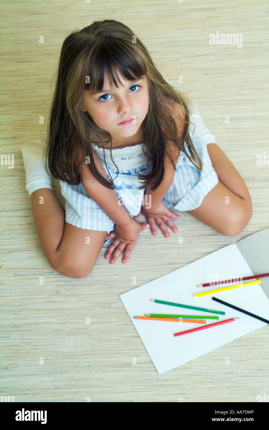 Girl coloring with colored pencils Stock Photo