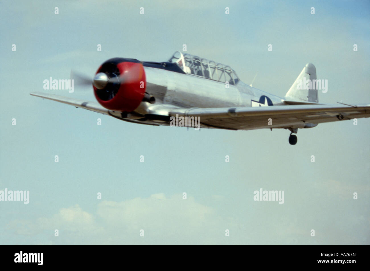 Photo of a North American AT 6 Fighter Trainer WW2 airplane in Flight Stock Photo