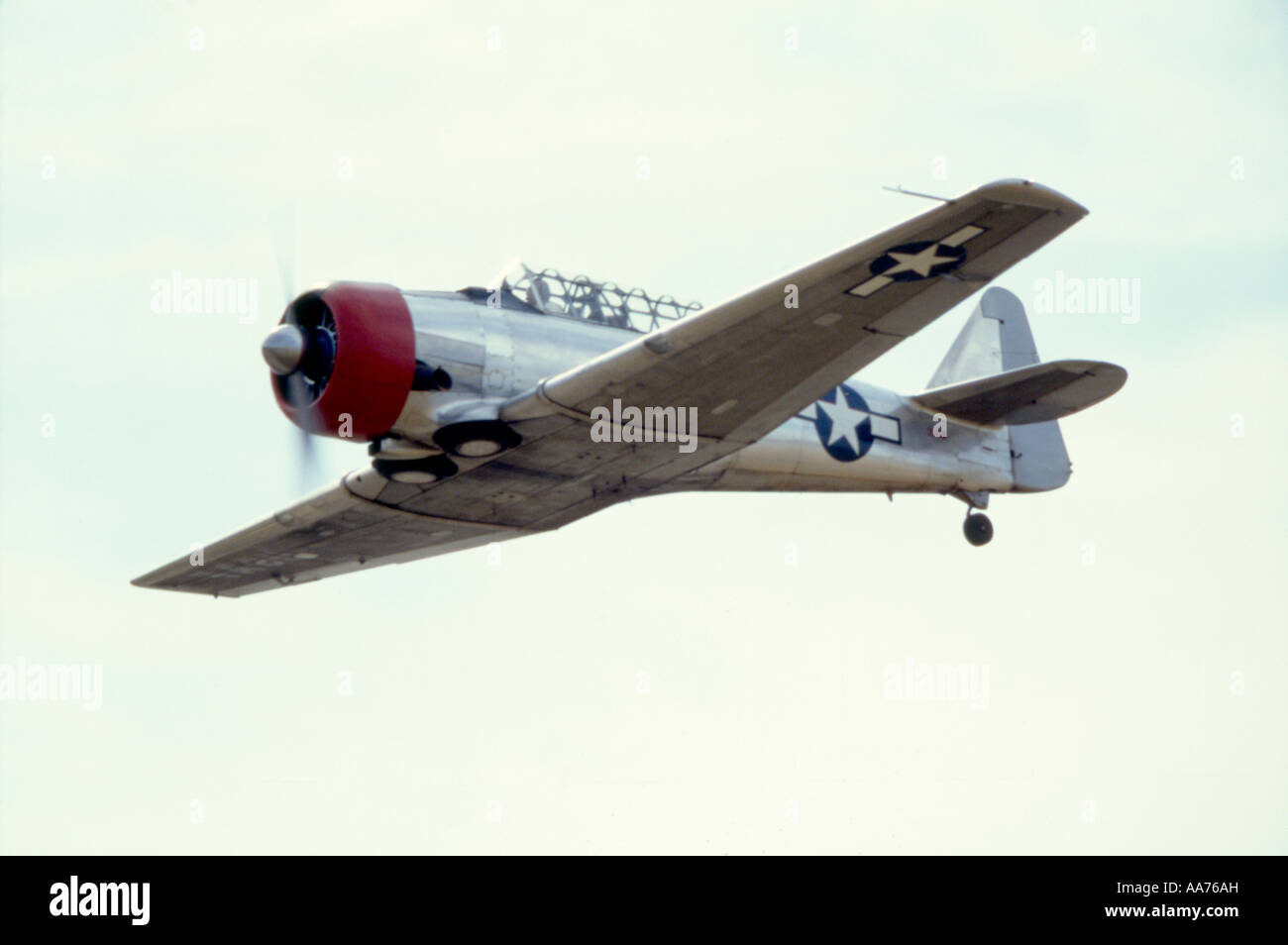 Photo of a North American AT 6 Fighter Trainer WW2 airplane in Flight Stock Photo