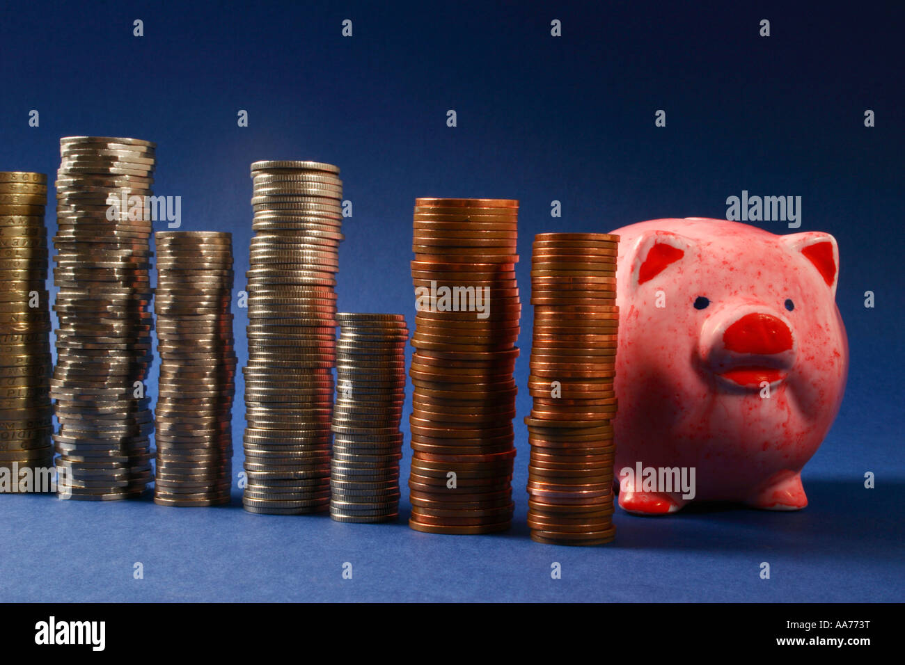 Savings "piggy bank" with stacks of money Stock Photo - Alamy