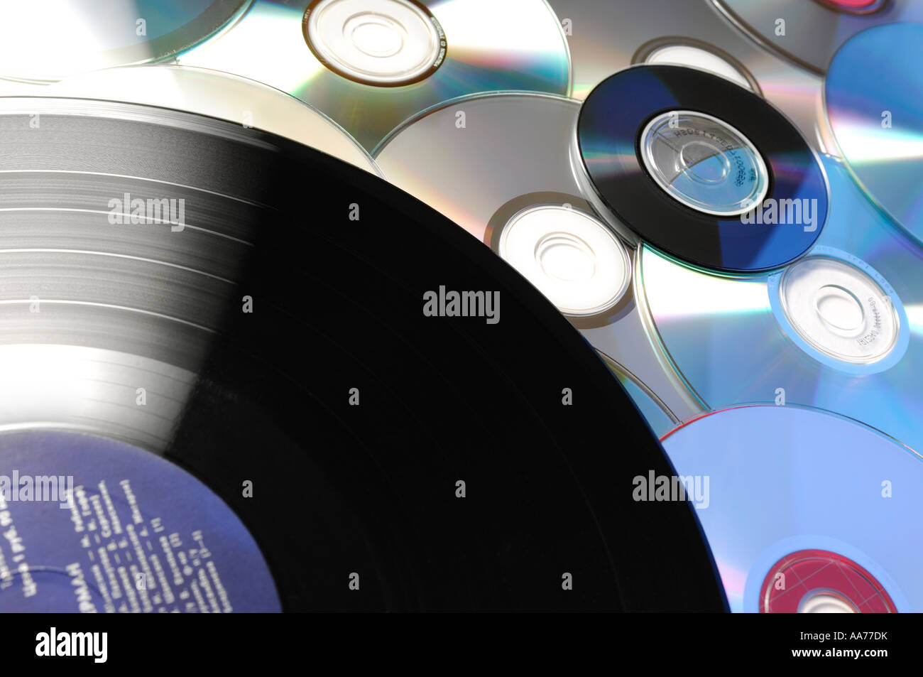 Compact disks and a vinyl record  information CD and DVD data storage music recording Stock Photo
