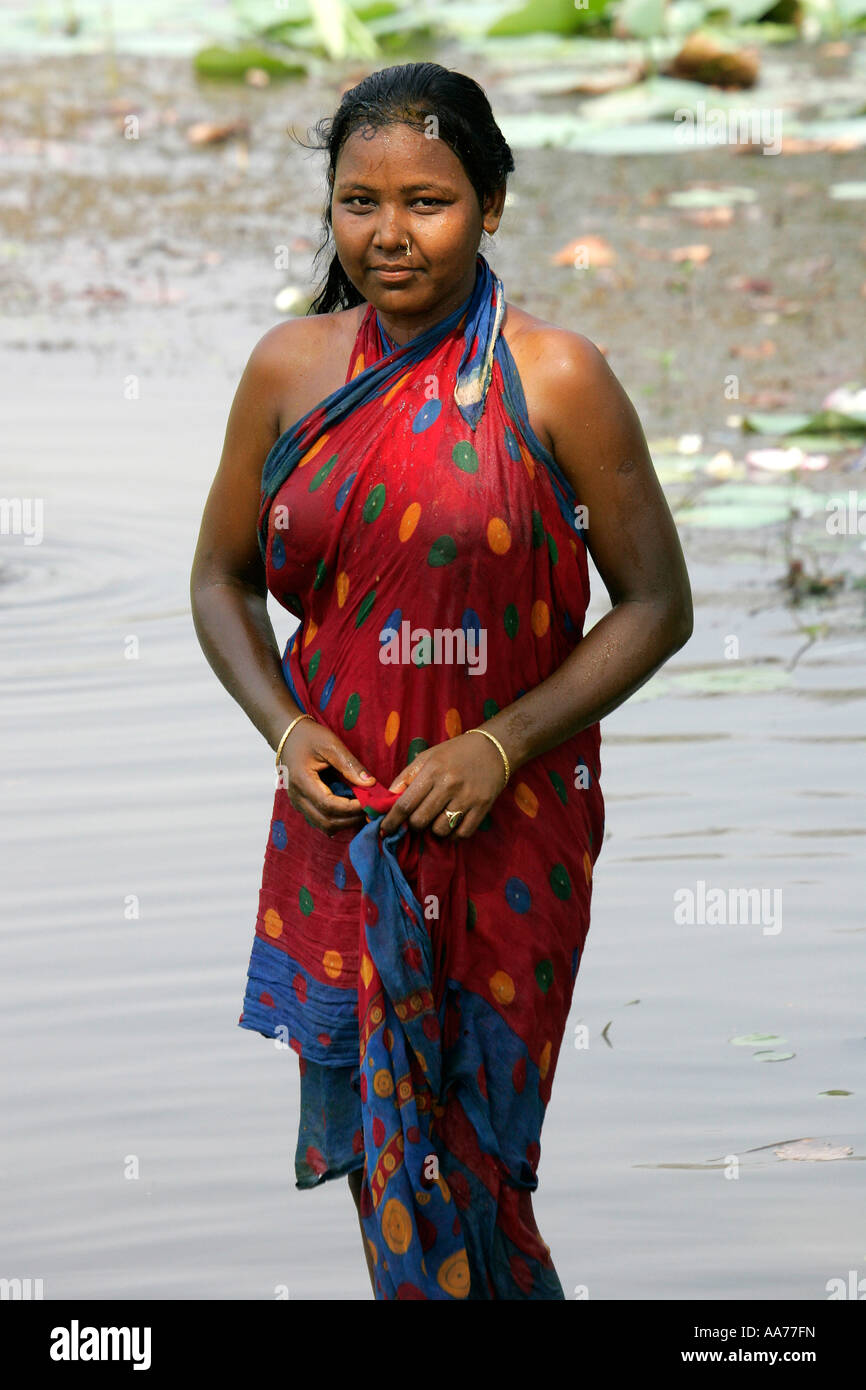 Woman Bathing At Bolgarh Village Orissa India Stock Photo