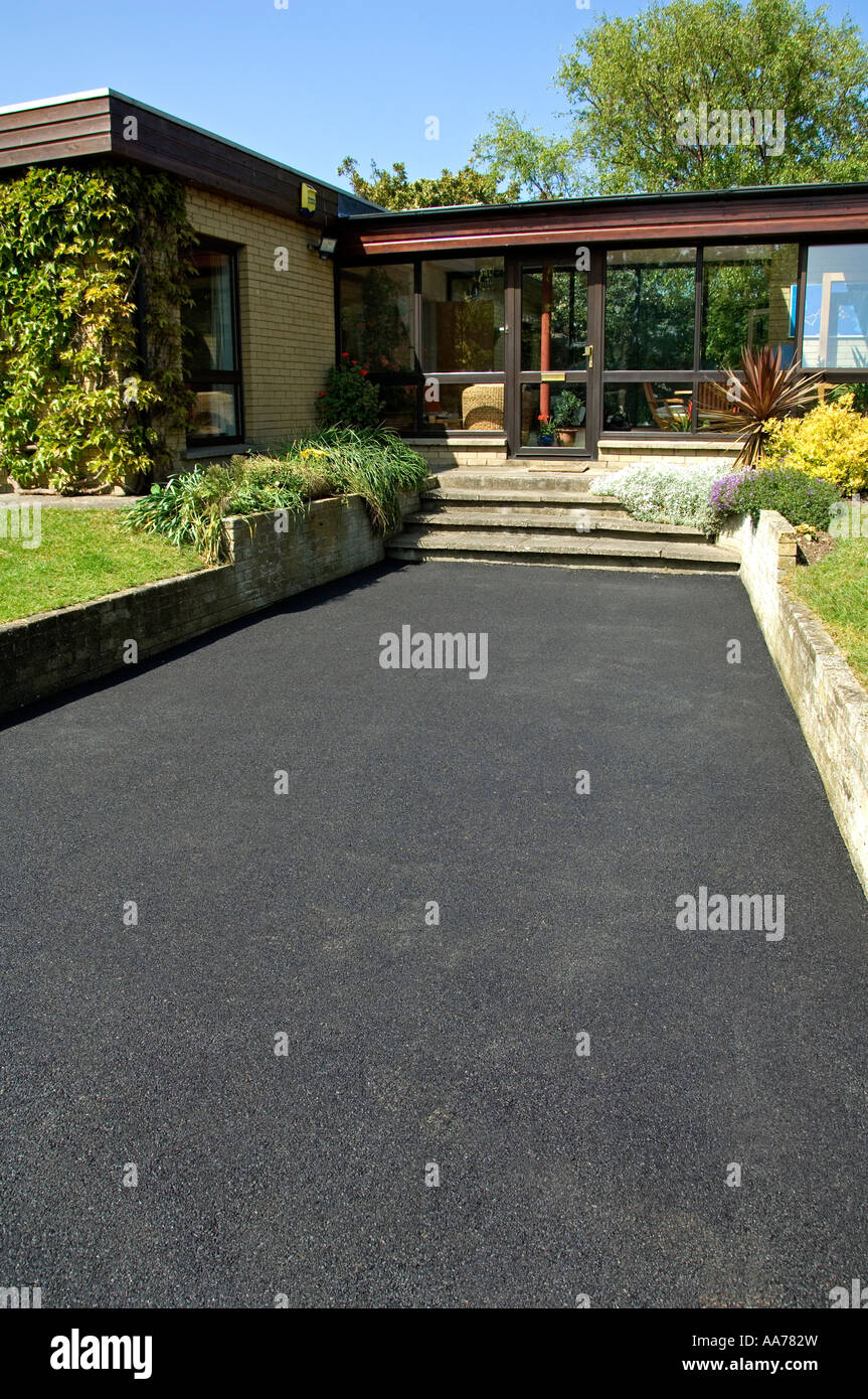 A new tarmacadam driveway at a private house Stock Photo