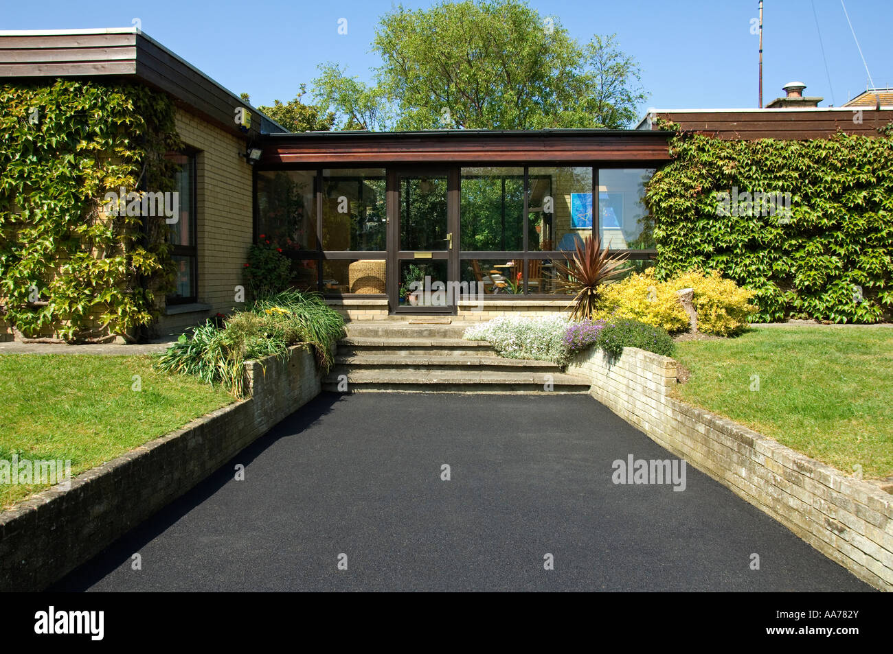 A new tarmacadam driveway at a private house Stock Photo