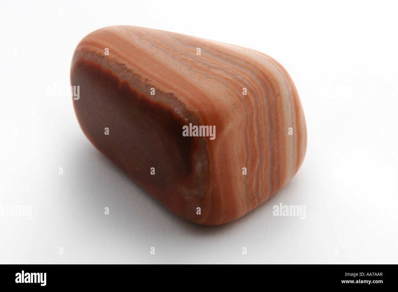 Striped orange calcite gem stone gemstone Isolated over white cutout