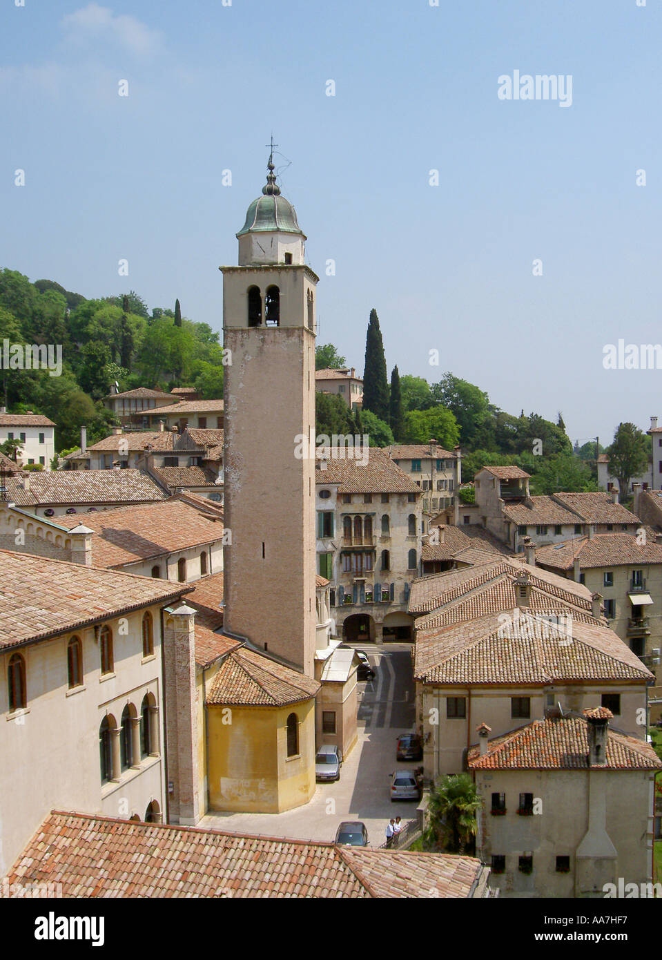 The cathedral campanile rises above the roof tiles in the centre of the ancient town of Asolo, Treviso, Italy Stock Photo