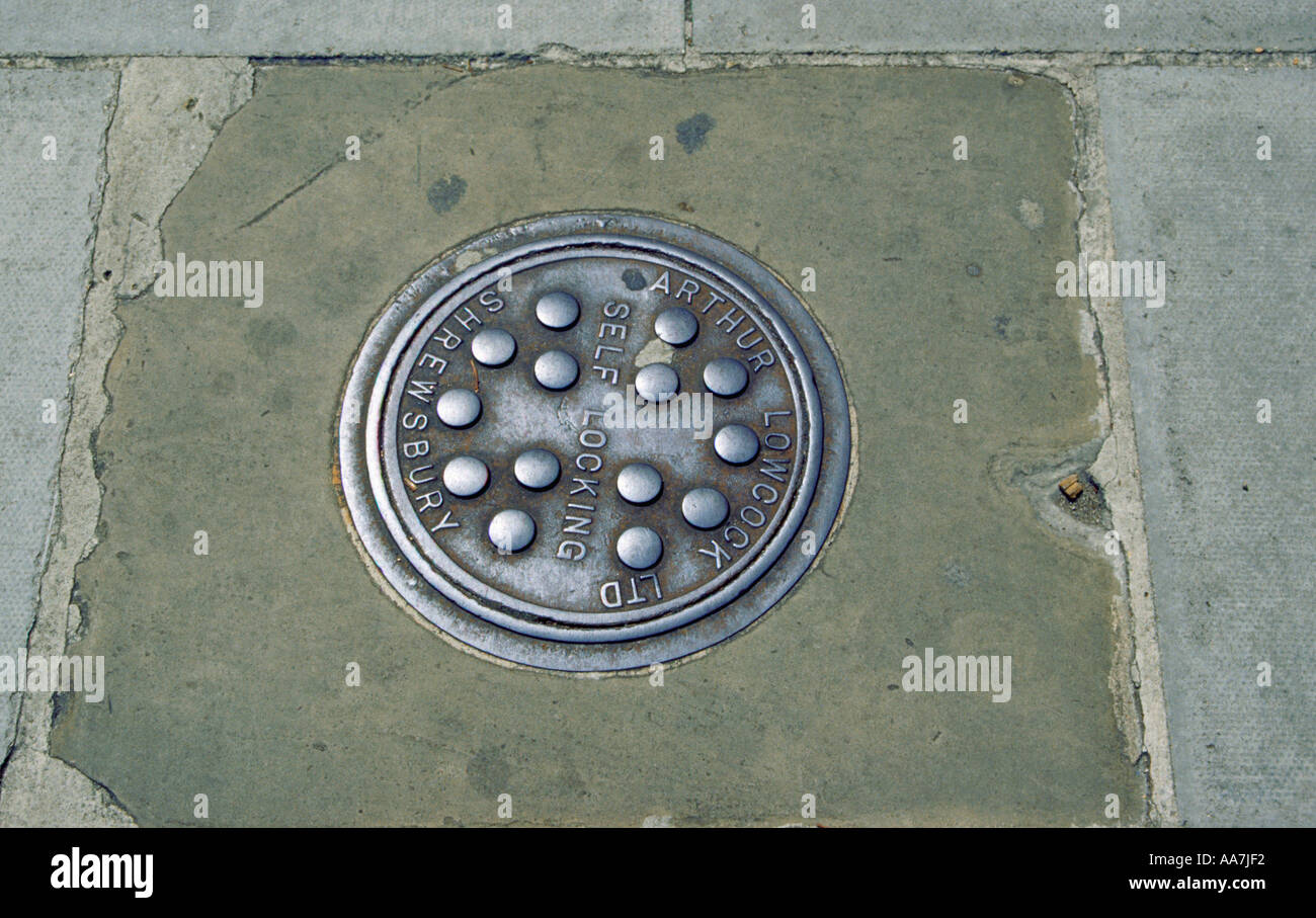 A close up of a manhole cover in Earls Court London England Stock Photo