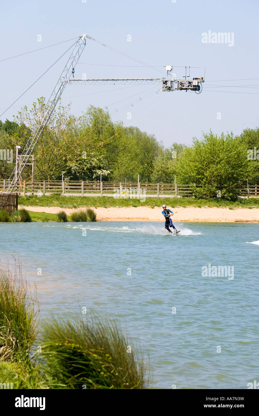 Wake boarding with a cable tow at Watermark Ski, Cotswold Water Park, South Cerney, Gloucestershire Stock Photo