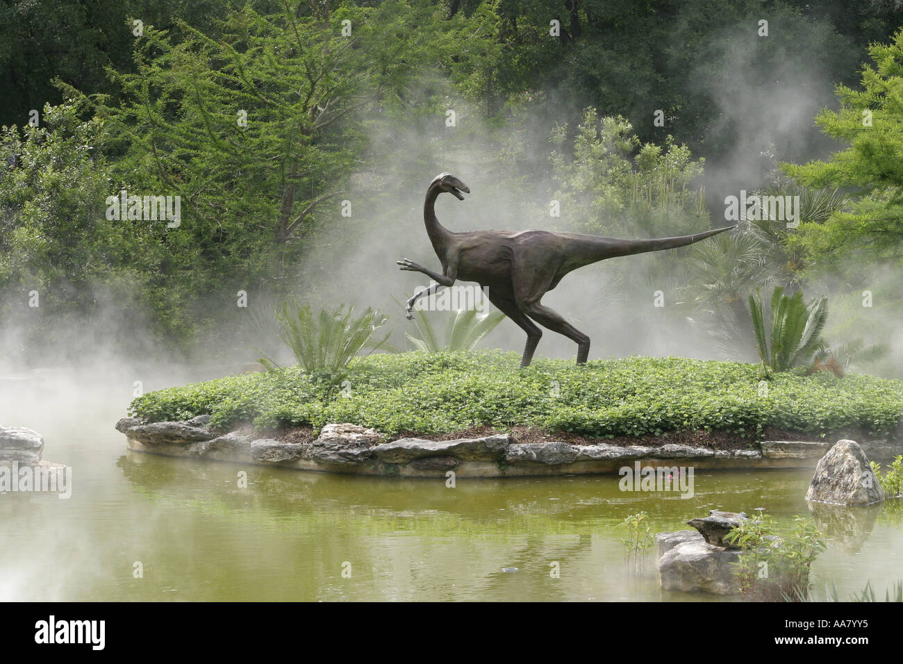 A raptor sculpture emerges from the mist in the Zilker Park Botanical