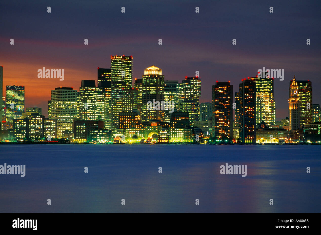 skyline at dusk across harbour Boston Massachusetts USA Stock Photo