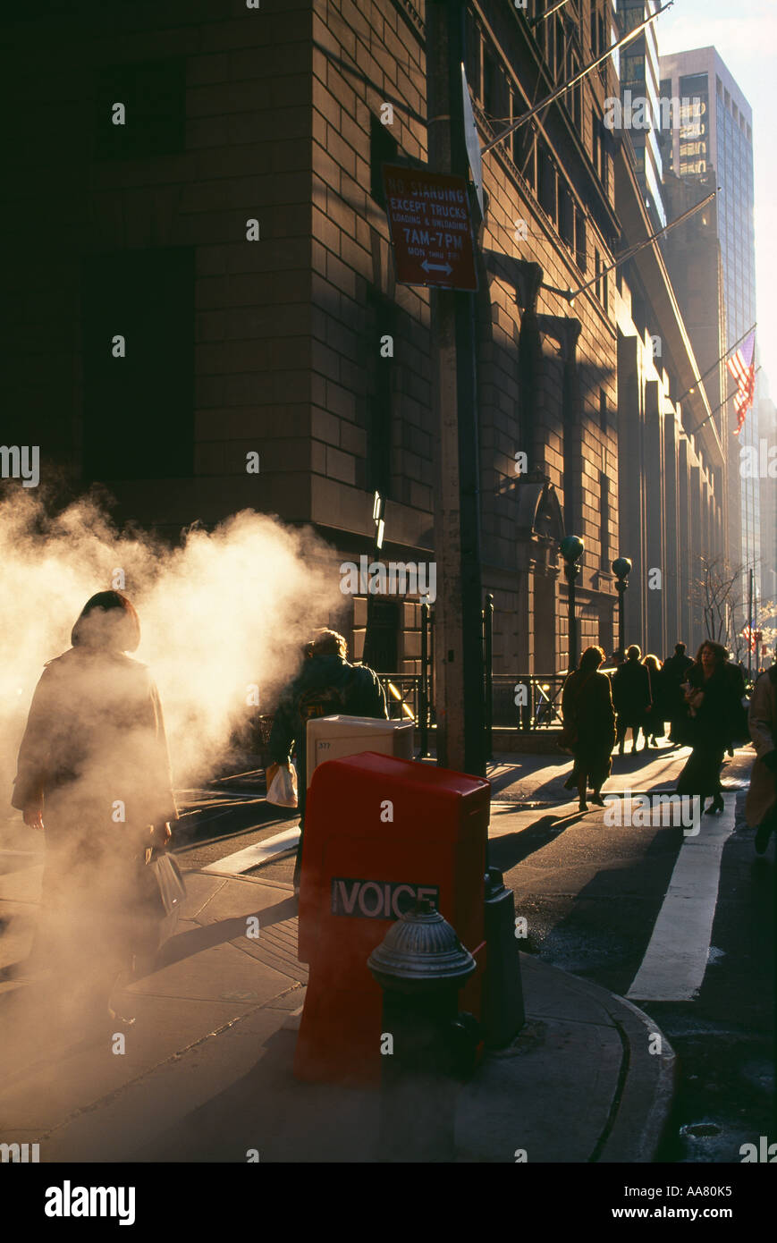 steaming vent and business people going to work Wall Street New York
