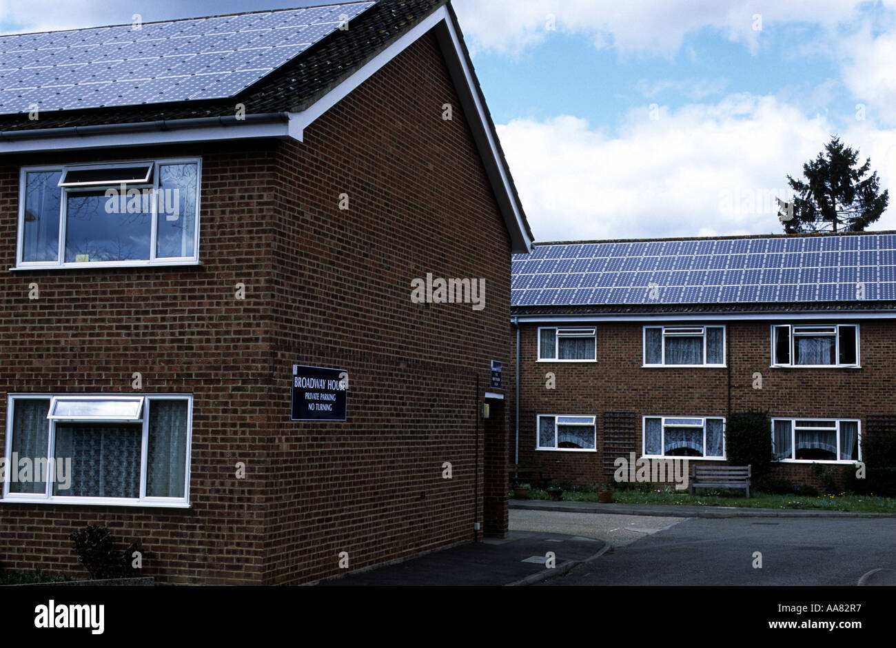 Photovoltaic panels producing solar energy to Broadway House, a sheltered housing complex, Knaphill, Woking, Surrey, UK. Stock Photo