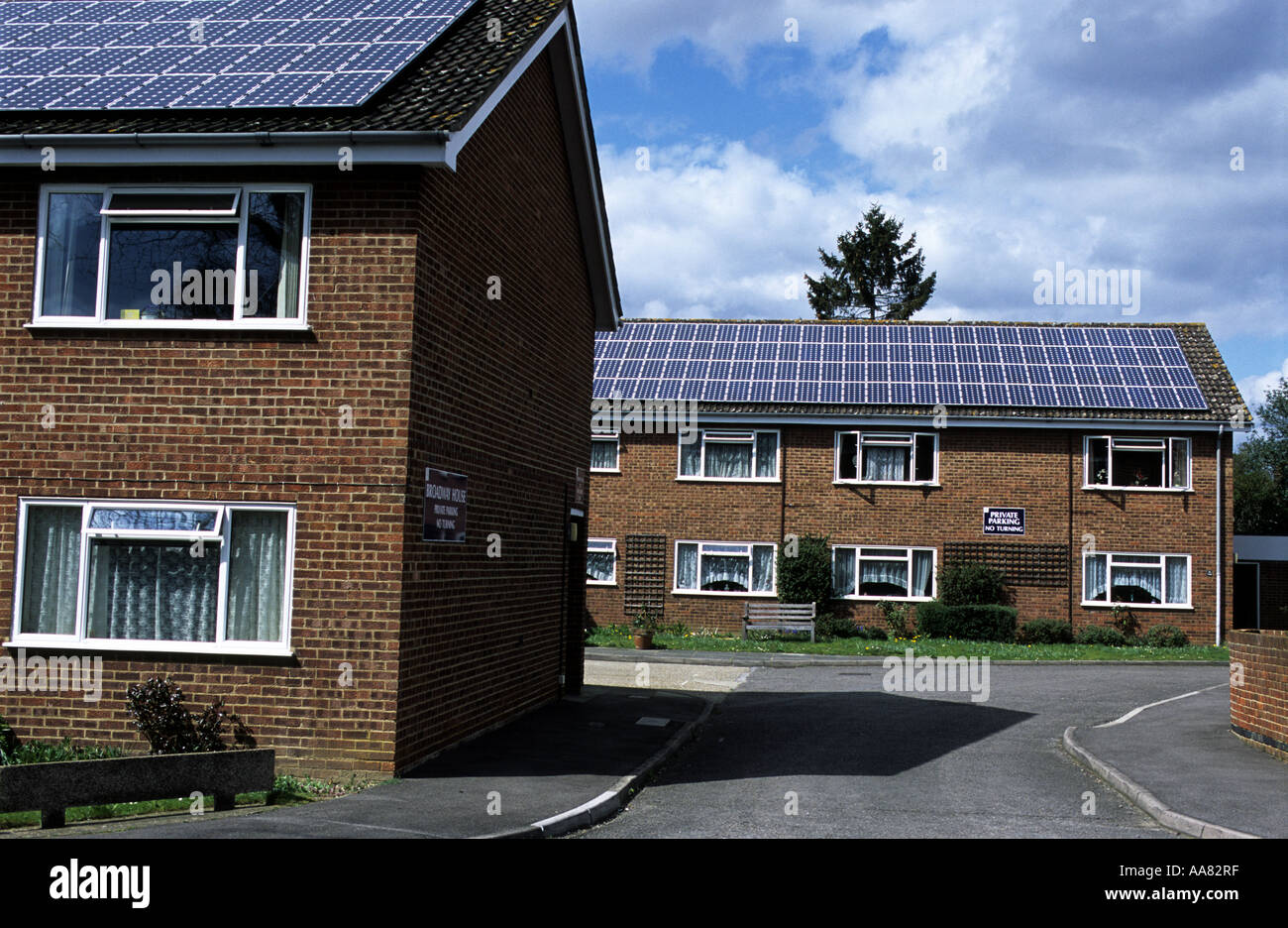 Photovoltaic panels producing solar energy to Broadway House, a sheltered housing complex, Knaphill, Woking, Surrey, UK. Stock Photo