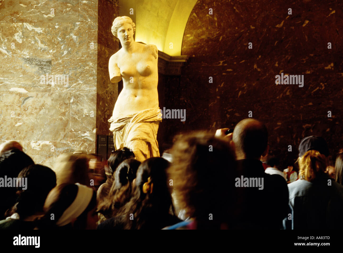 Paris Louvre Museum's Venus de Milo (Aphrodite of Milos) ancient Greek statuesurrounded by tourists Stock Photo