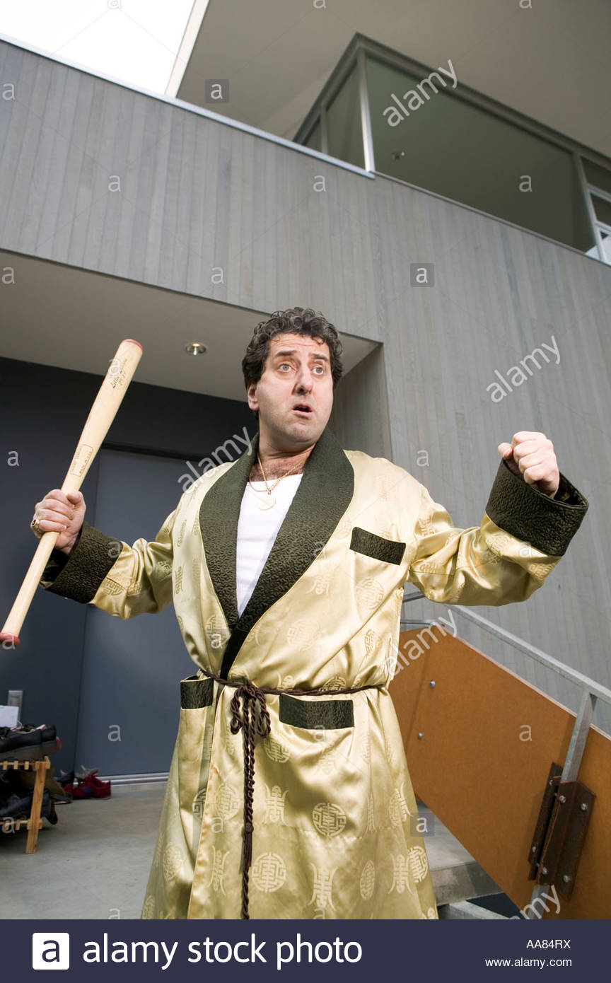 Man in bathrobe holding baseball bat Stock Photo 12545629 Alamy
