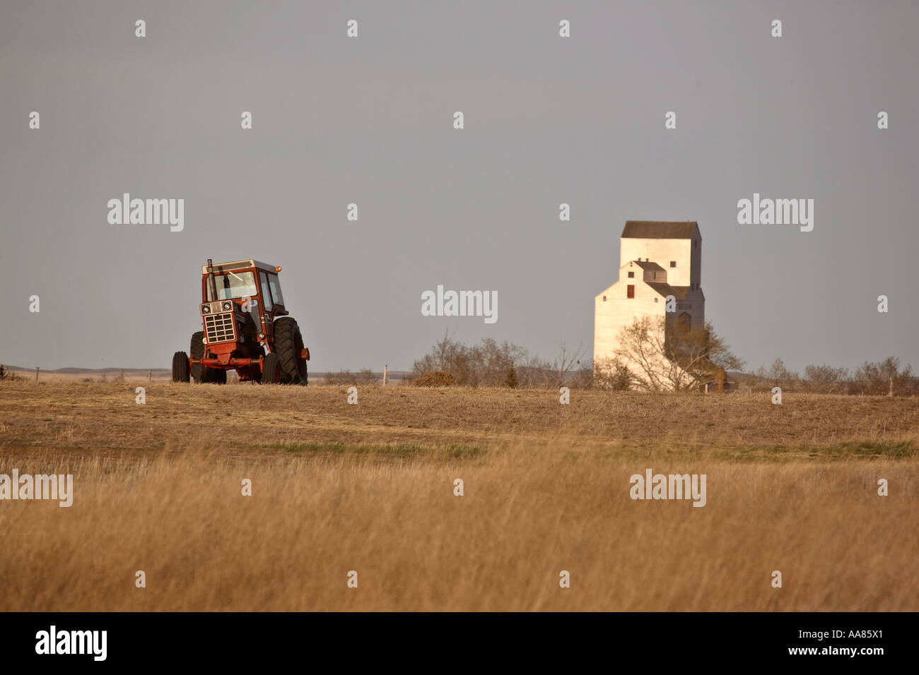 Tractor in field near Crane Valley in scenic Saskatchewan Canada Stock