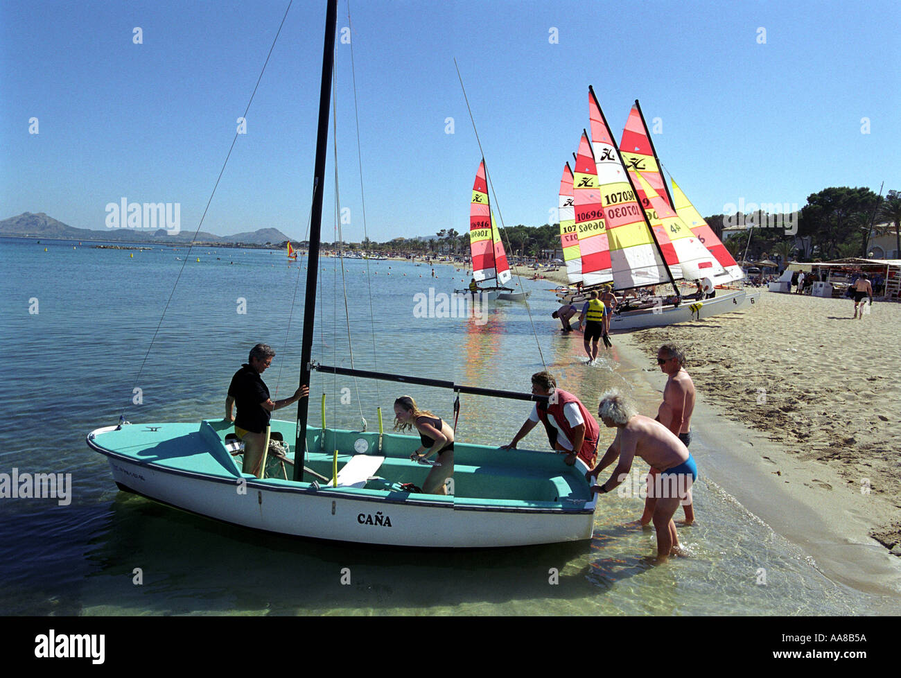 Sailing boats on the beach at Puerto Pollensa in Majorca Stock Photo