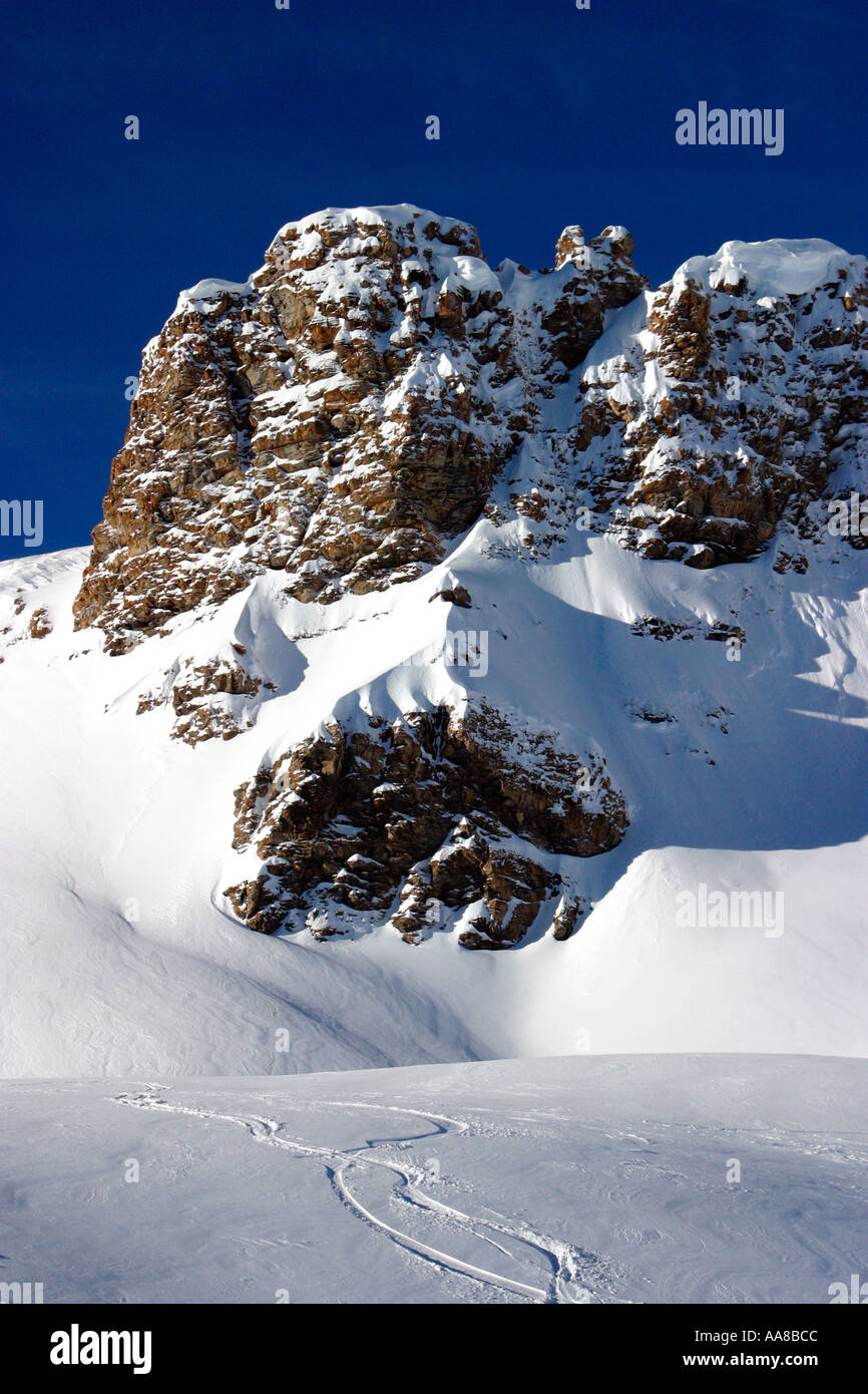 Ski tracks on a ski slope in the Swiss Alps Stock Photo