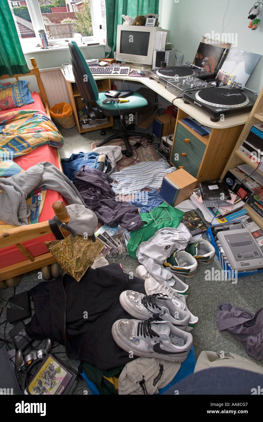 Boys bedroom in a very messy condition with cloths and rubbish strewn