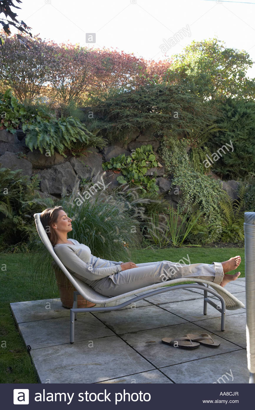 Woman Sleeping In Lounge Chair Stock Photos & Woman Sleeping In Lounge