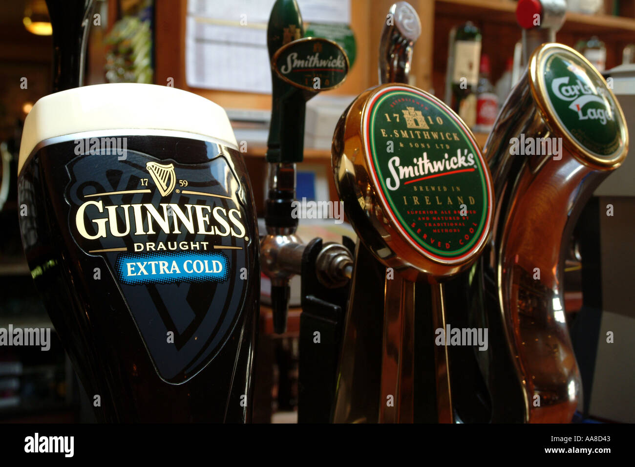 Beer pumps in Irish bar.  Wicklow Mountains area near Dublin, Southern ireland. Guinness sign Stock Photo