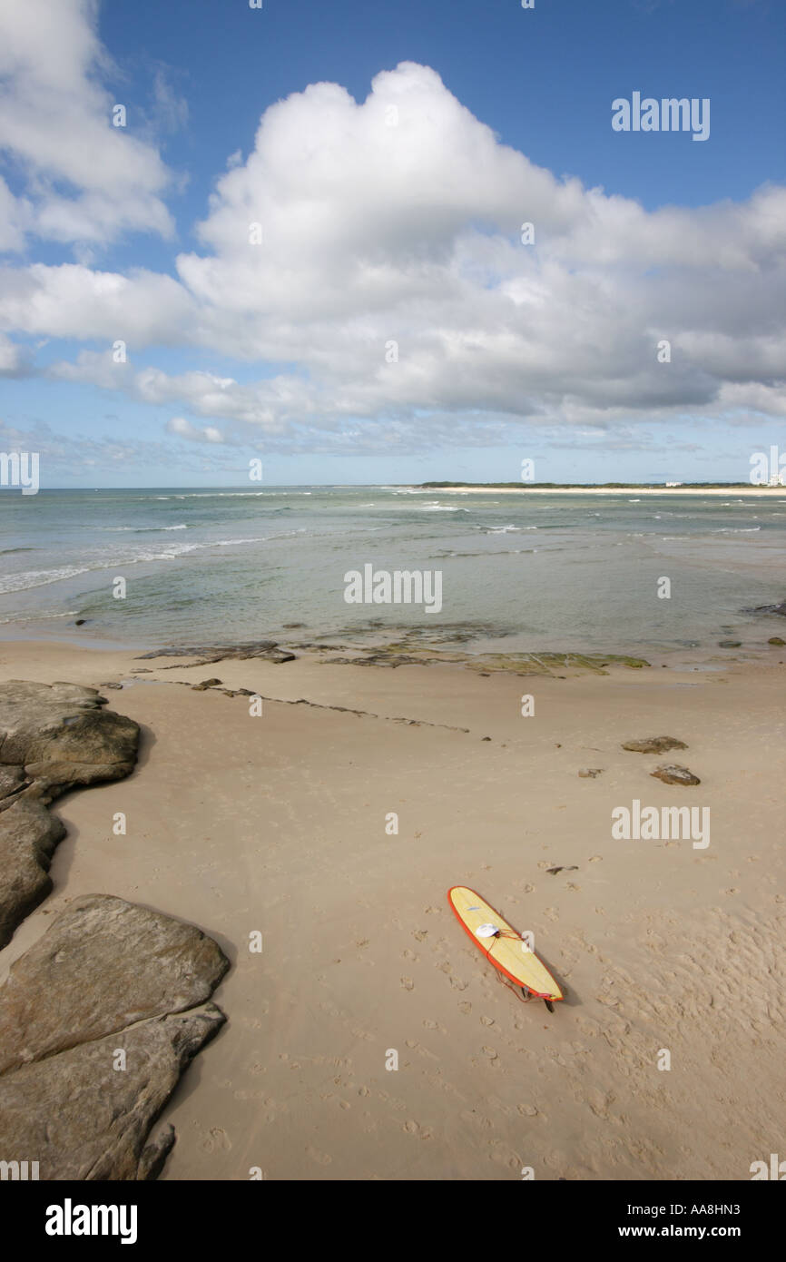 LONE SURFBOARD LAYING ON THE BEACH CALOUNDRA QUEENSLAND AUSTRALIA ...
