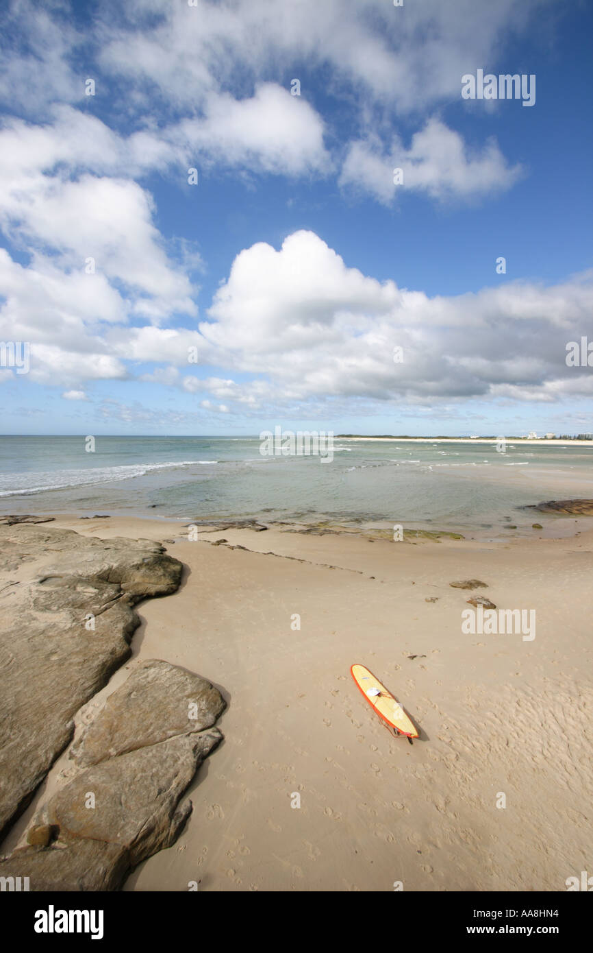 LONE SURFBOARD LAYING ON THE BEACH CALOUNDRA QUEENSLAND AUSTRALIA ...