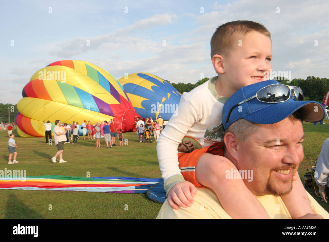 Alabama Morgan County,Decatur,Alabama Jubilee Hot Air Balloon Classic,flight,father dad,parent parents,son on shoulders,visitors travel traveling tour Stock Photo