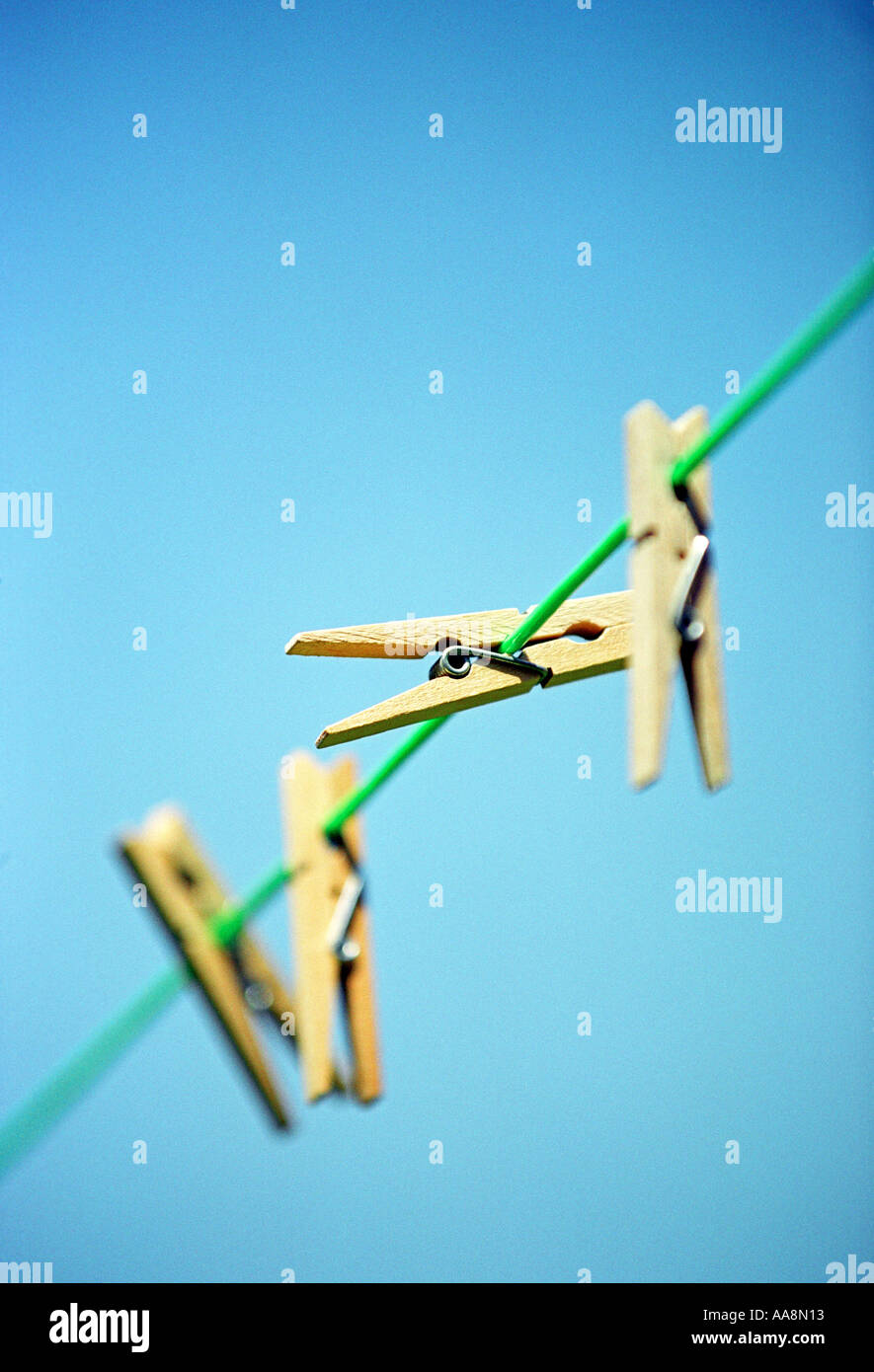 Clothes pegs on a washing line Stock Photo