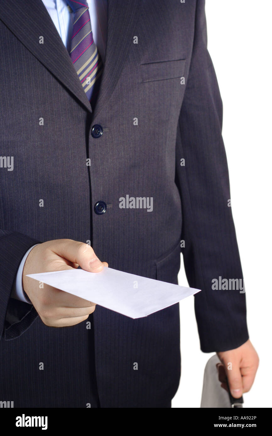 Businessman handing over a blank letter Stock Photo