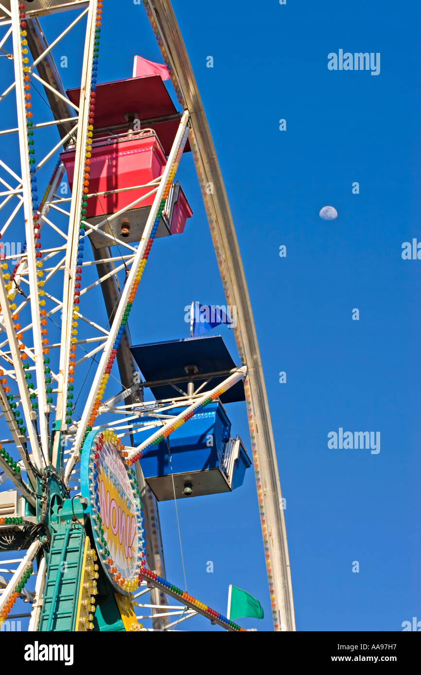Carnival ride ferriswheel 2 pod moon in sky Stock Photo - Alamy