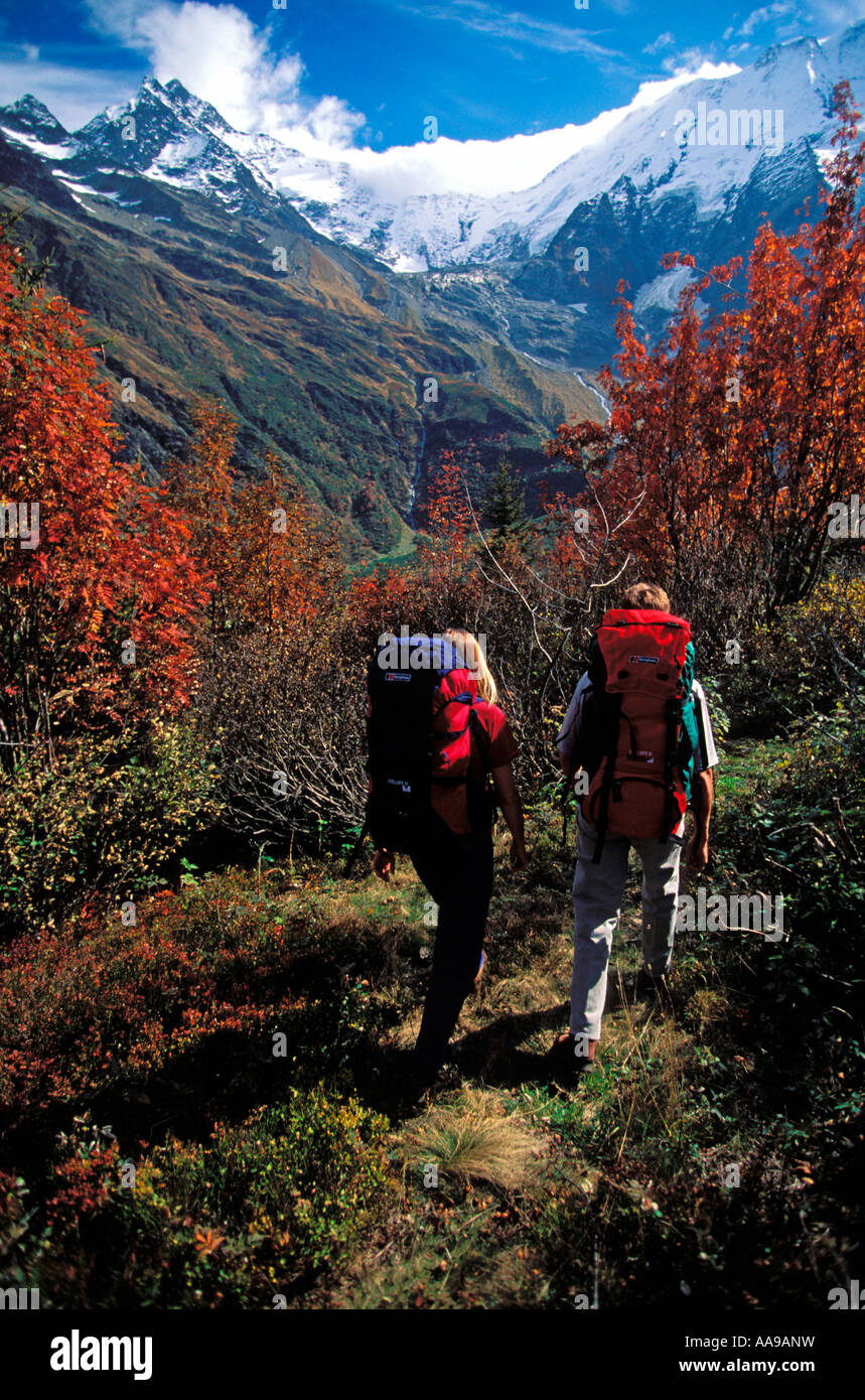 Trekkers with backpacks walking in the mountains of the Chamonix area ...
