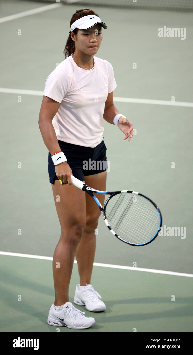 Portrait of Chinese tennis star Li Na in action in Doha Qatar March 2006 against Daniella Hantuchova Stock Photo