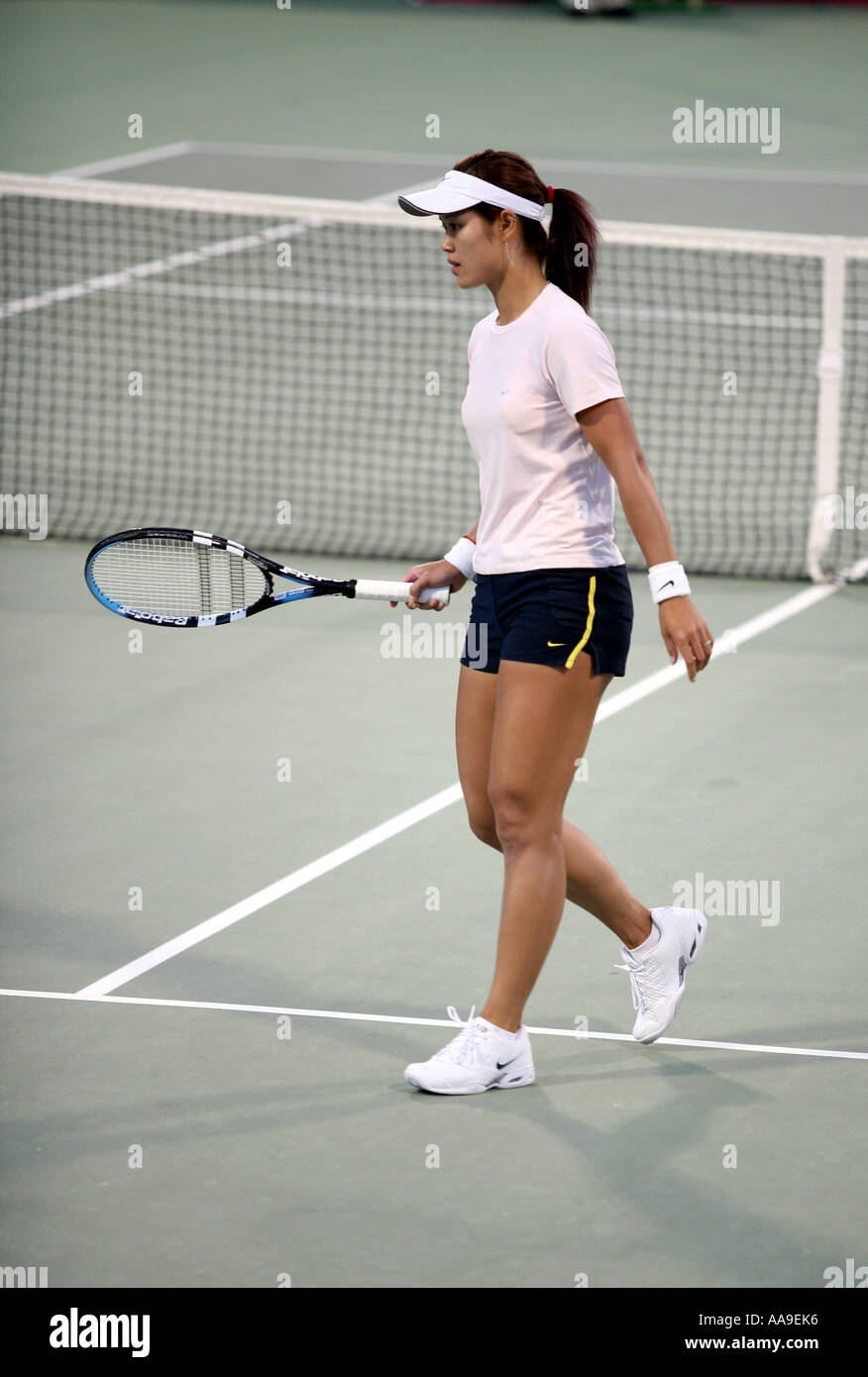 Chinese tennis star Li Na in action in Doha Qatar March 2006 against Daniella Hantuchova Stock Photo