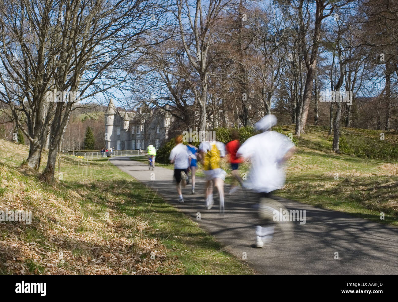 Blurred moving althletes at Balmoral Castle road race running events in
