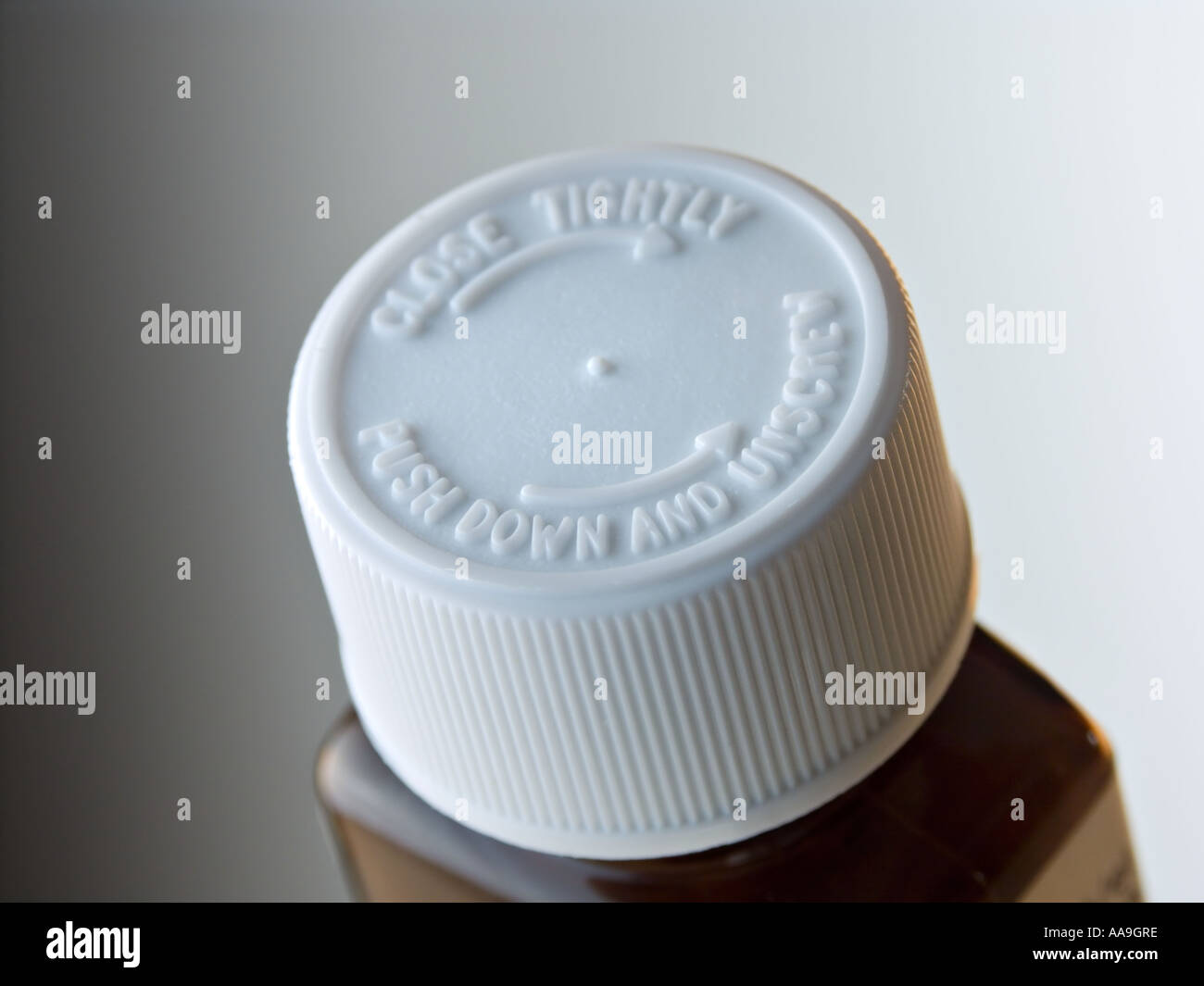 Brown plastic drugs bottle with childproof screw cap Stock Photo