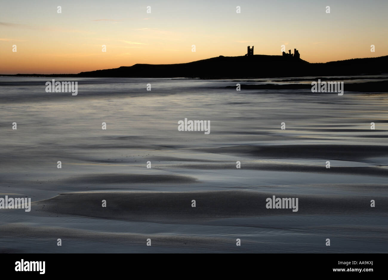 dunstanburgh-castle-at-sunrise-northumberland-uk-stock-photo-alamy