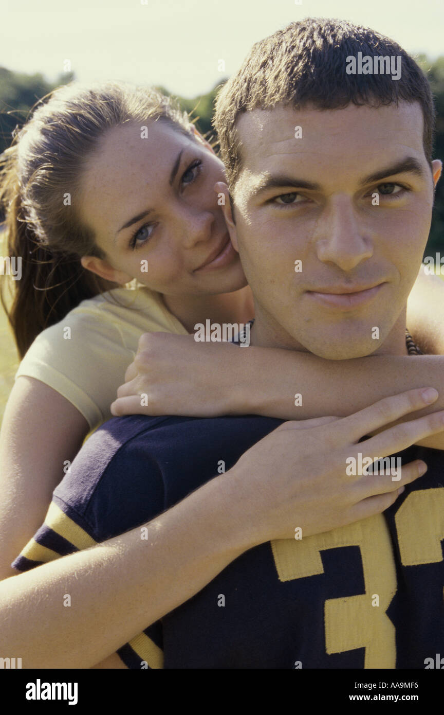 Woman arms around man looking at him hi-res stock photography and ...