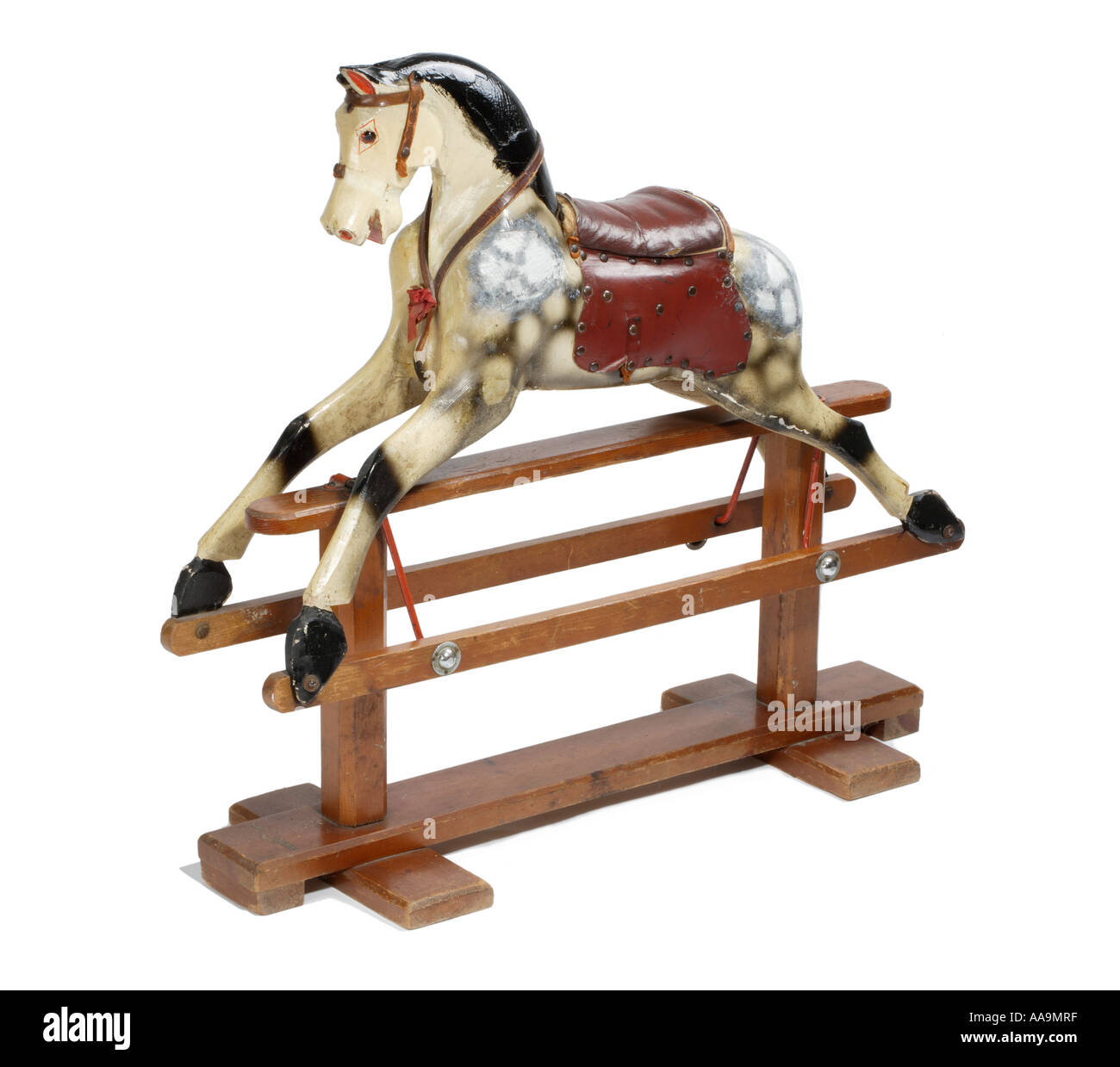 Rocking horse Carved wood old and worn and chipped Stock Photo